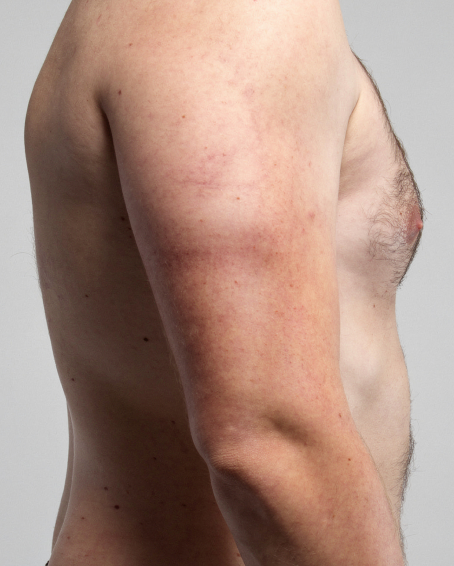 AI-generated close view of a character's shoulder, arm and skin texture